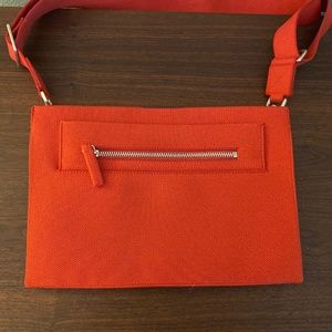 Gently used Rothy’s The Dual Zip CrossBody Bag -Orange